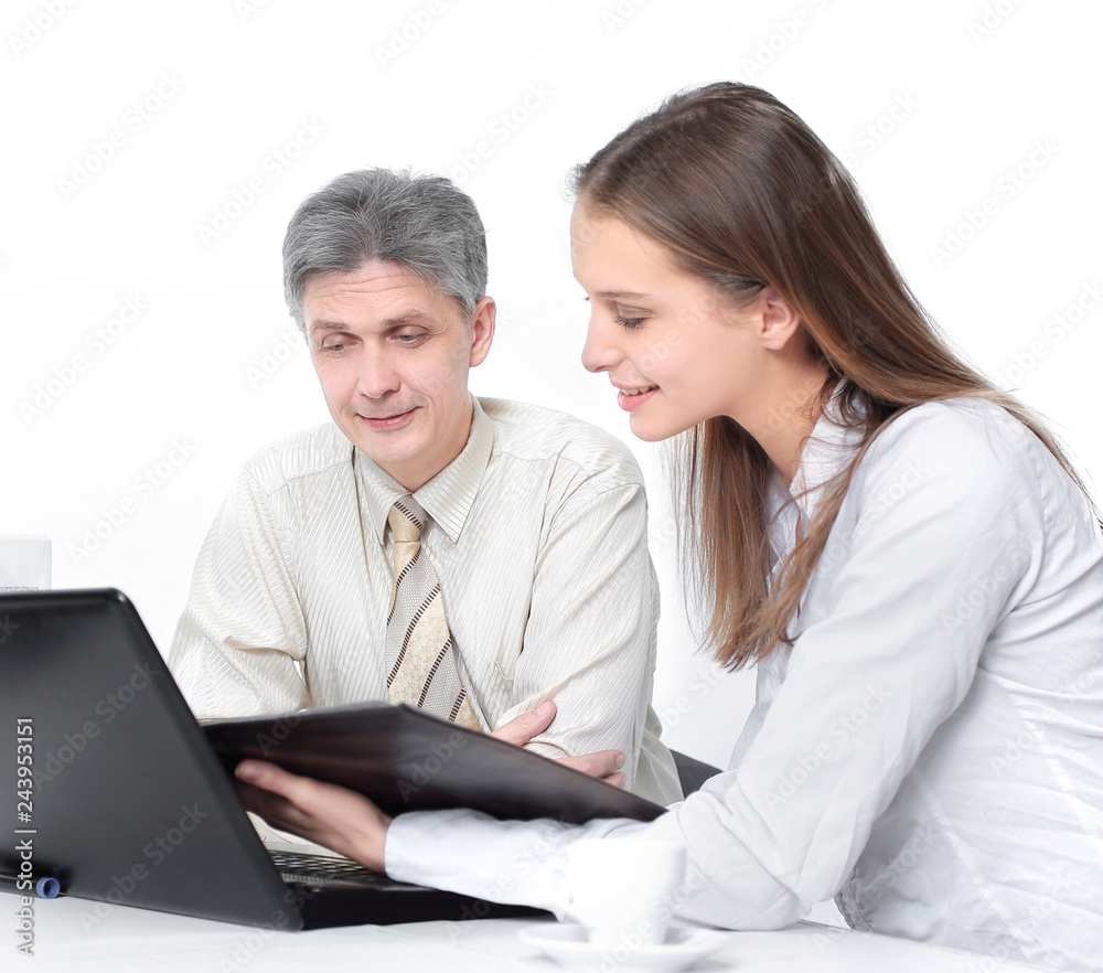 Manager and a young officer discussing financial records. Manager and a young officer discussing financial records.