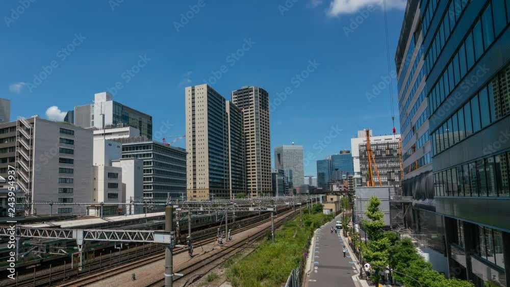 Timelapse of Urban Railroad Tracks in Office District in Tokyo -Pan Left- Timelapse of Urban Railroad Tracks in Office District in Tokyo -Pan Left-