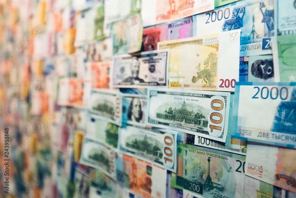 Close-up international banknote background for global currencies concept for money exchange business. Money from different countries: dollars, euros, rubles. One hundred and fifty dollars