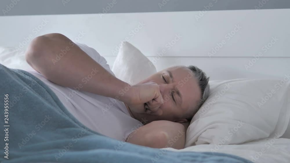 Sick Gray Hair Man Coughing while Sleeping in Bed Sick Gray Hair Man Coughing while Sleeping in Bed