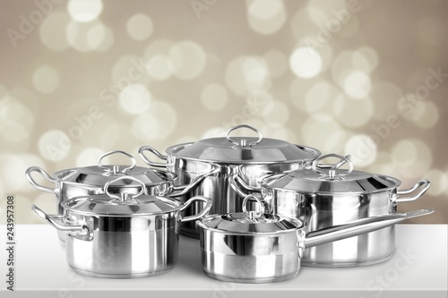 Collection of aluminum pans on wooden table