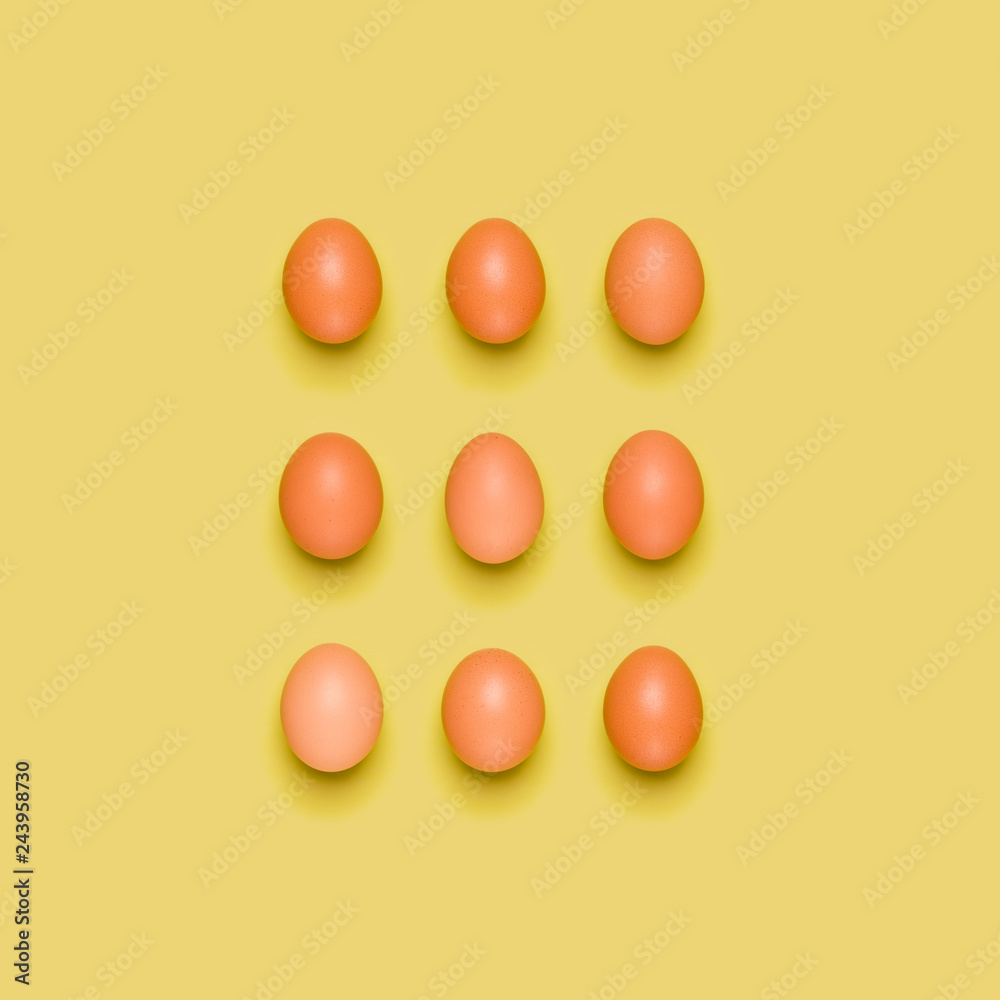 Eggs pattern on yellow background. Easter concept. Flat lay, top view. Food background. Eggs pattern on yellow background. Easter concept. Flat lay, top view. Food background.