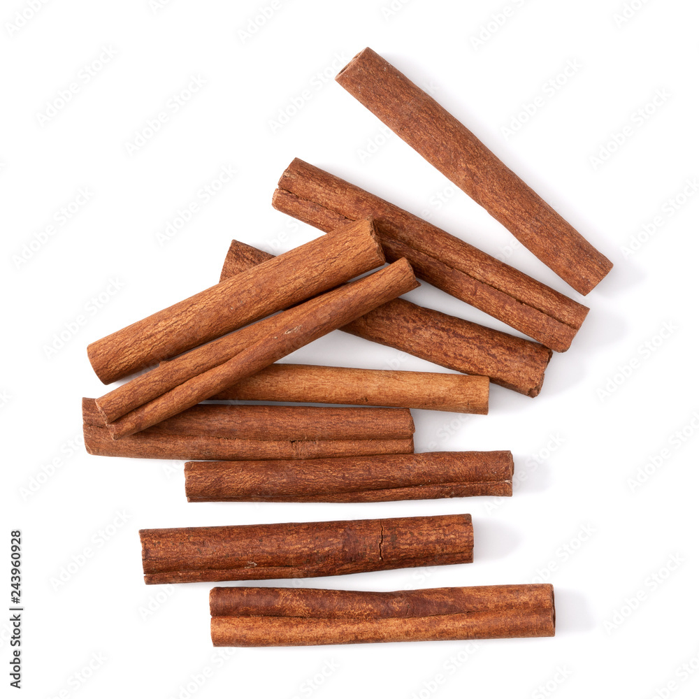 Cinnamon sticks isolated on white background closeup. Canella spice. Aromatic condiment background. Flat lay, top view. Cinnamon sticks isolated on white background closeup. Canella spice. Aromatic condiment background. Flat lay, top view.