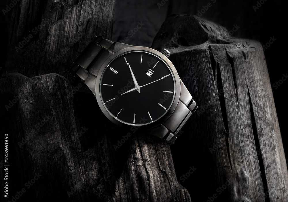 custom made wallpaper toronto digitalLuxury black metal wristwatch, on top of a pile of coal, with lots of contrast and texture