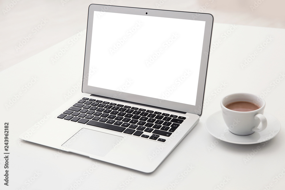 Comfortable workplace with modern laptop on table. Mockup for design Comfortable workplace with modern laptop on table. Mockup for design