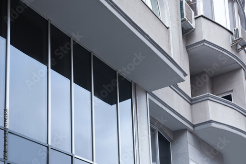 Modern office building with tinted windows. Urban architecture
