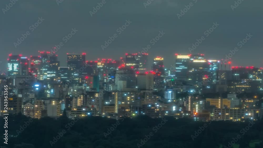 Timelapse of City Skyline over Urban Forest at Night in Tokyo -Pan Right- Timelapse of City Skyline over Urban Forest at Night in Tokyo -Pan Right-