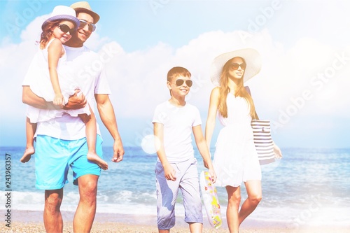 Happy family on vacations on beach
