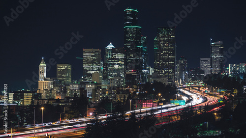 Popular Seattle Skyline View at Night with Business Office Buildings and Car Streaks