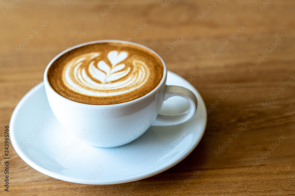 A cup of coffee on old wooden table in cafe coffee break in morning A cup of coffee on old wooden table in cafe coffee break in morning