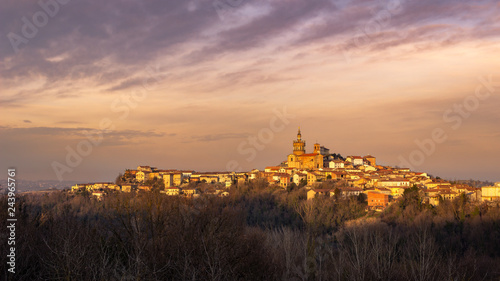 Winter sunset in the Monferrato hills. Village of Camagna, Piedmont, Italy. Peaceful sight.