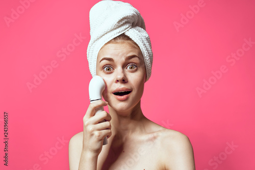 facial massage peeling young woman with a towel on her head