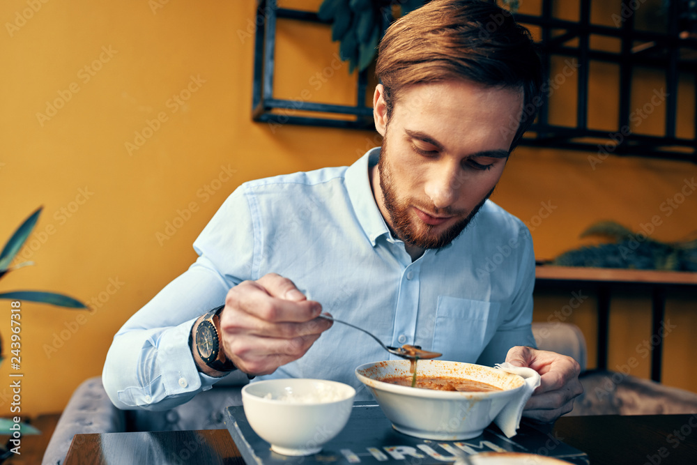 business man eating soup at a cafe lunch business man eating soup at a cafe lunch