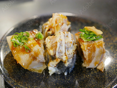 Close up of beacon and deep-fried nori seaweed maki rolls - adapted Japanese sushi rolls to use other ingredients than just raw meats