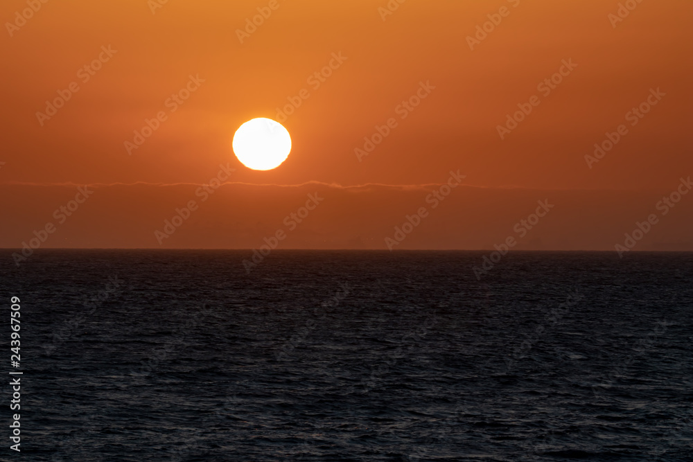 dark orange sunset over the ocean 