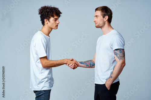 friends greet each other shake hands