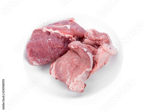 Fresh pork on a white plate isolated white background.