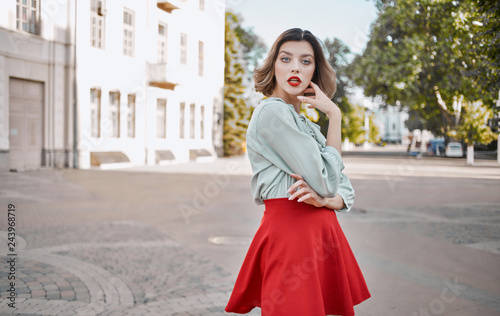 beautiful woman in a skirt on a city street