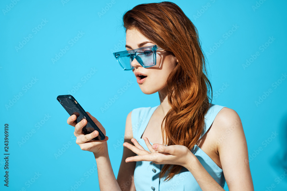 woman in glasses with a phone