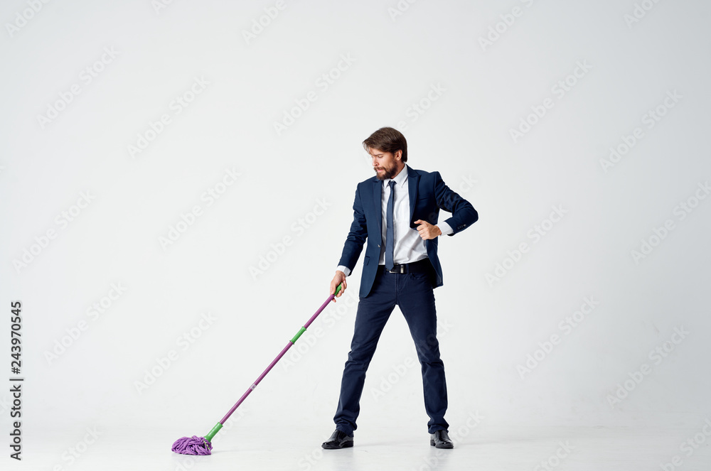 business man with a mop on a light background business man with a mop on a light background