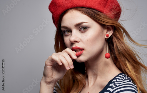 woman in beret earrings portrait