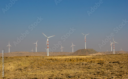 8553816 Windmills of Rajasthan against the blue sky