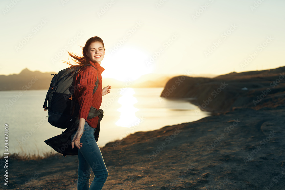happy woman with backpack sunset sea trip