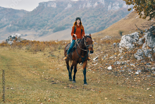 woman riding a horse mountains nature