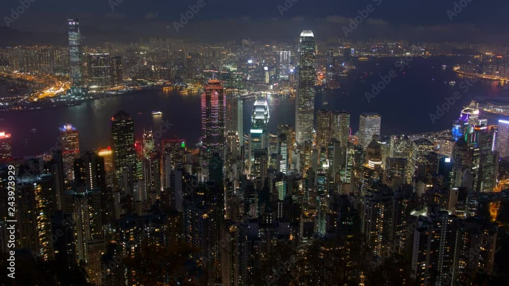 Hong Kong skyline urban panorama at night time lapse China. zoom out Hong Kong skyline urban panorama at night time lapse China. zoom out