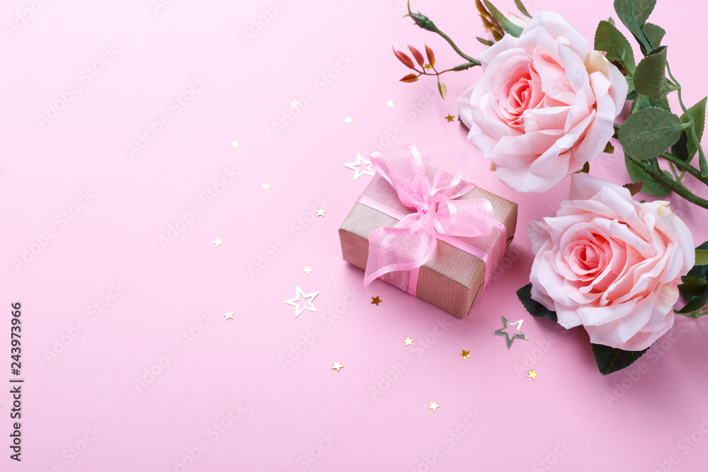 Gift box and pink roses