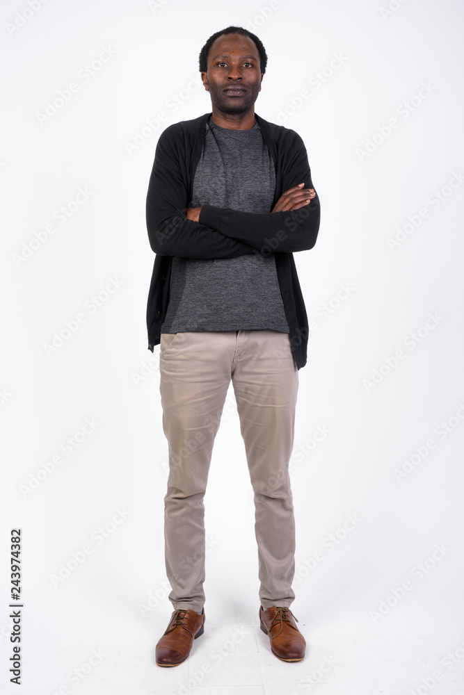 Full body shot of handsome African man with arms crossed Full body shot of handsome African man with arms crossed
