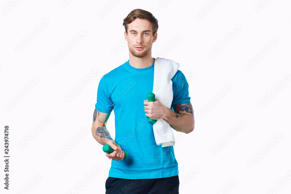 man with a towel with fitness dumbbells man with a towel with fitness dumbbells