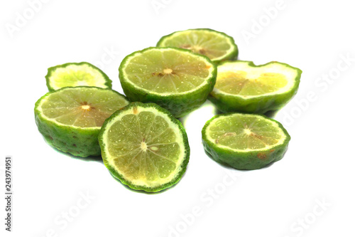 Bergamot or Kaffir lime Cut half isolate on black background
