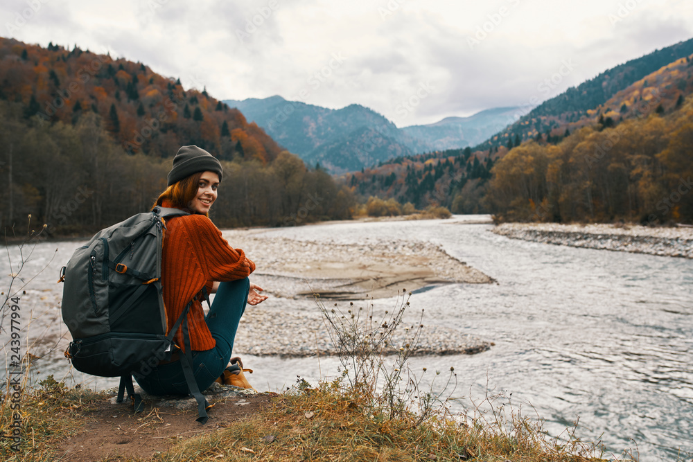 river woman autumn trip