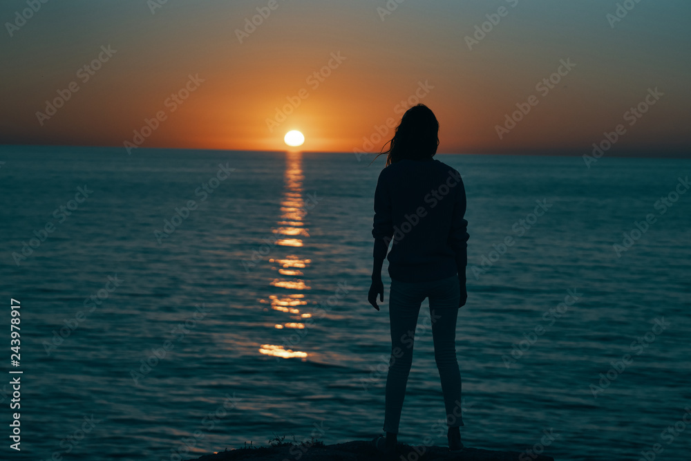 sunset sea silhouette woman