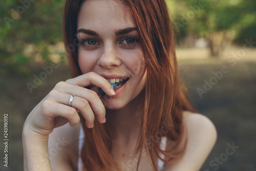 woman in white t-shirt eats