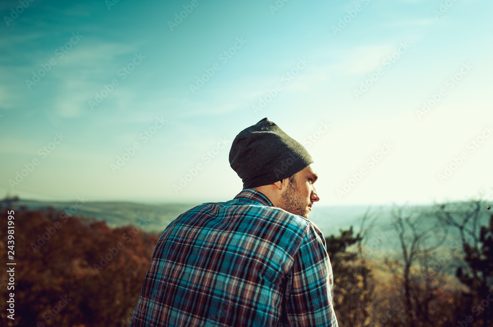 Guy looking at the mountain landscape. Nature and hiking concept. Guy looking at the mountain landscape. Nature and hiking concept.