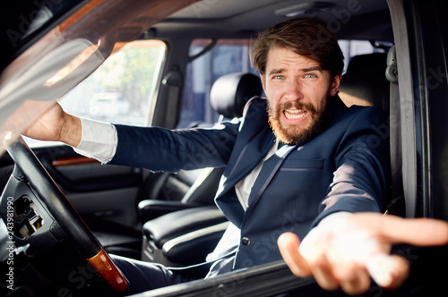 business man with a beard riding a car talking © SHOTPRIME STUDIO