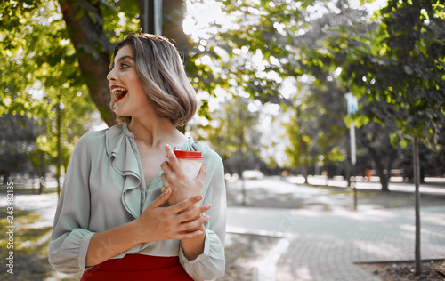 woman with coffee in the street