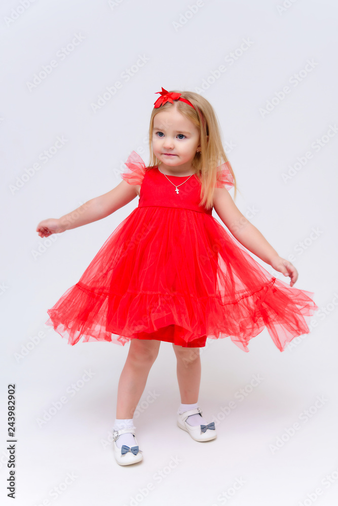 Concept portrait of a cute little girl in fashionable clothes. beautiful child