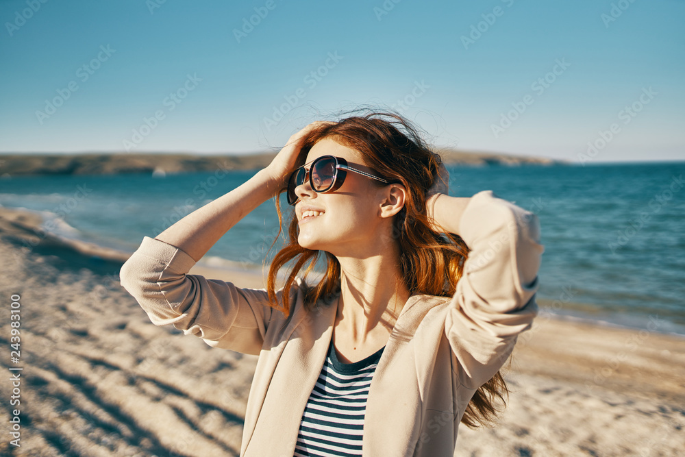 happy woman with glasses on the sea nature rest