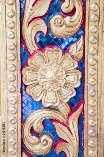Blue and gold floral mosaic detail trim on door at Doi Suthep temple in Chiang Mai Thailand