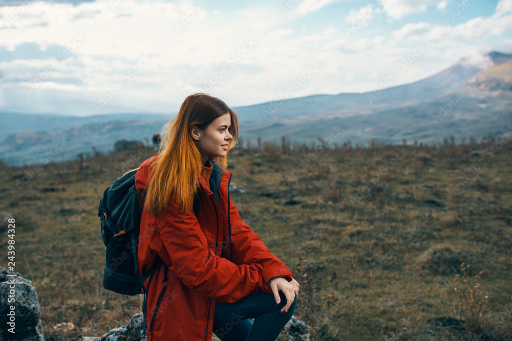woman in the mountains with a backpack nature travel autumn woman in the mountains with a backpack nature travel autumn