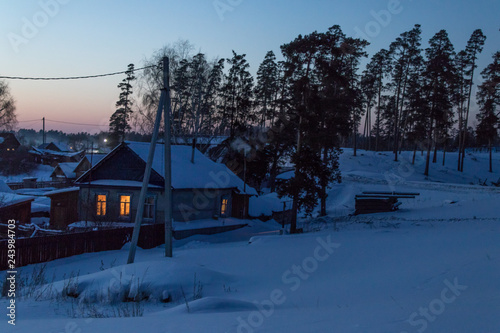 Obraz na płótnie evening village in a pine forest w salonie