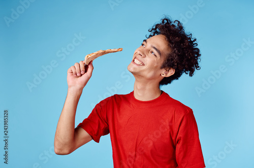 african man with pizza on blue background