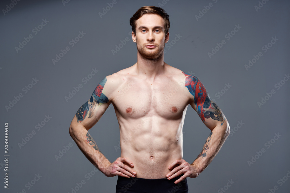 muscular man tattoo