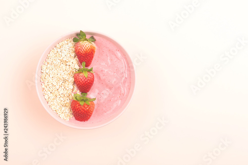 Smoothie bowl on yellow background