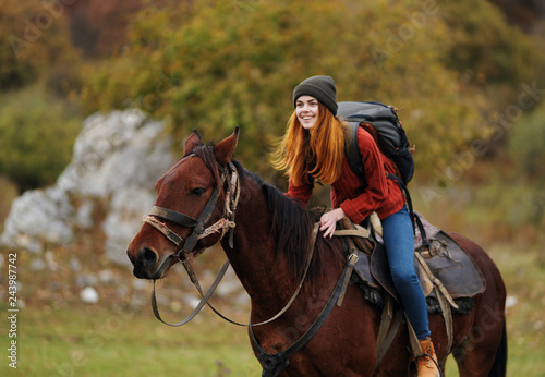 woman riding a horse nature