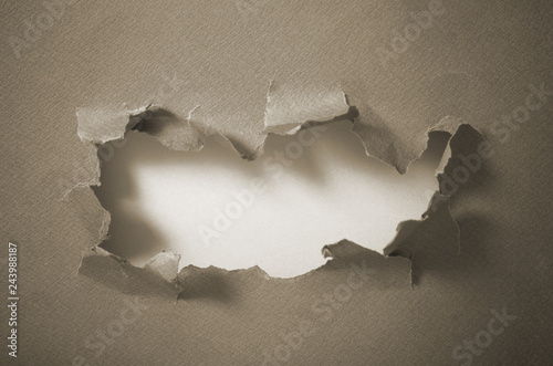 Hole in blue paper  abstract background