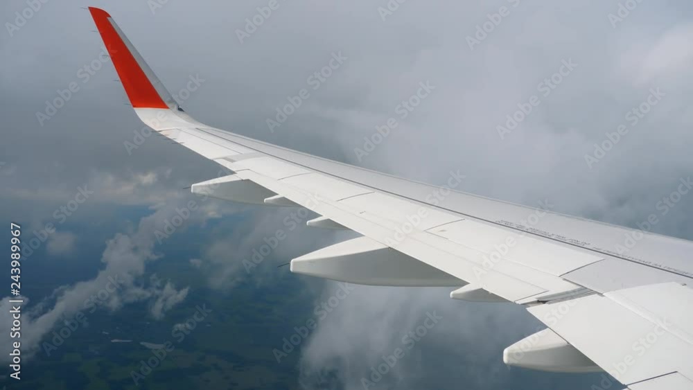 Wing of airplane on sky and cloud on moving Wing of airplane on sky and cloud on moving